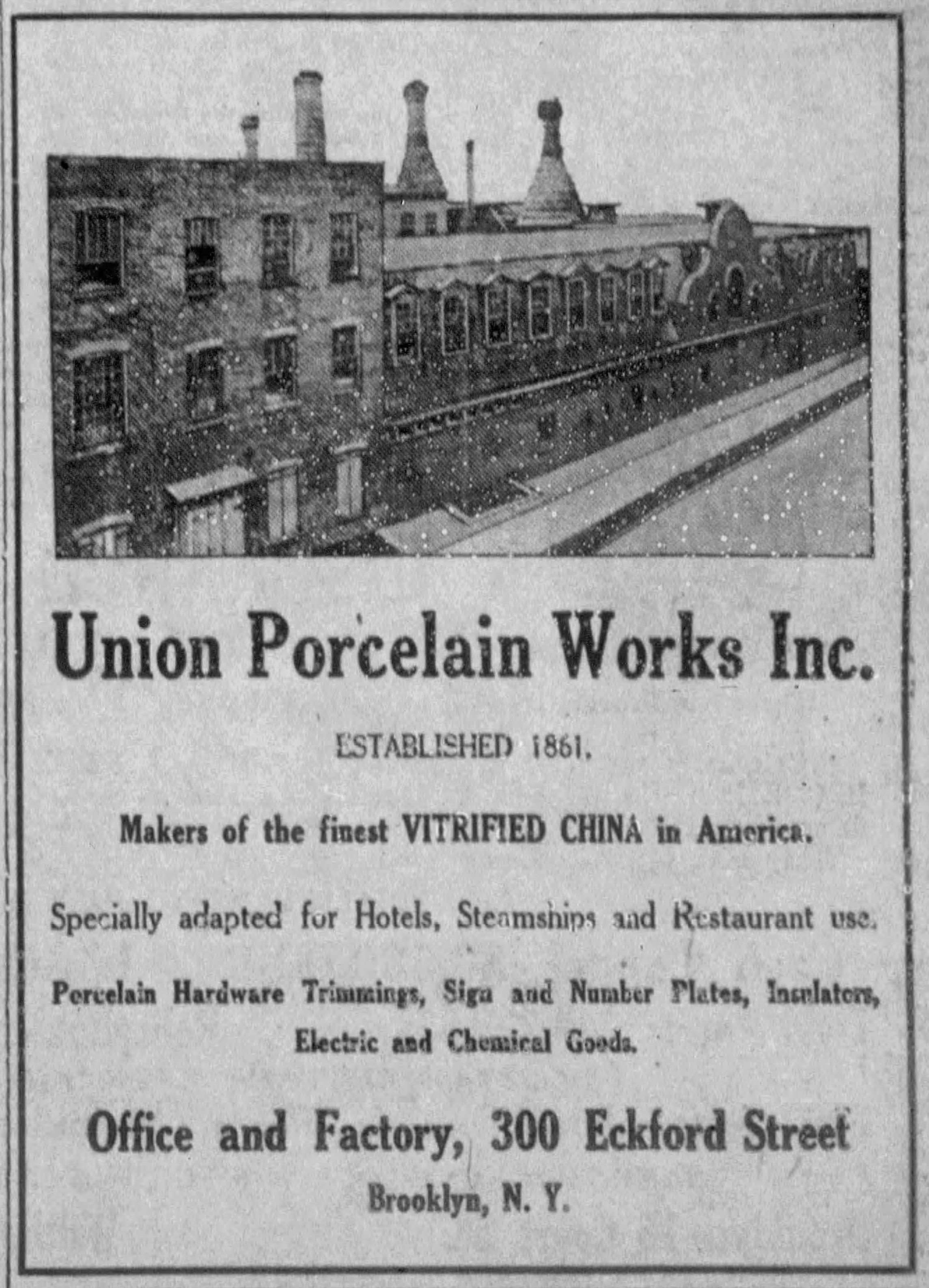 Long factory facade with huge kiln towers rising from its center.