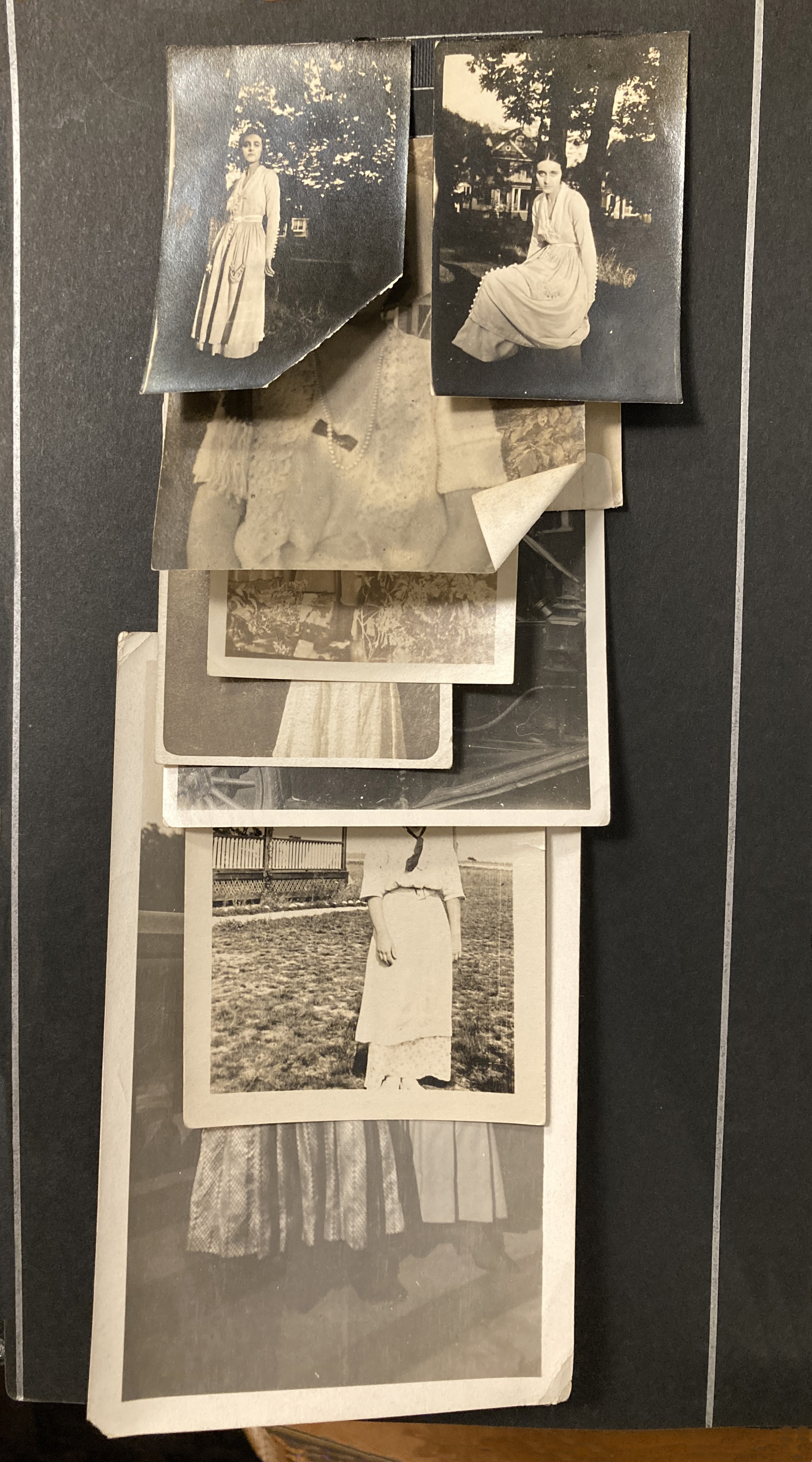 stack of photos in an albu with several portraits of a young woman.