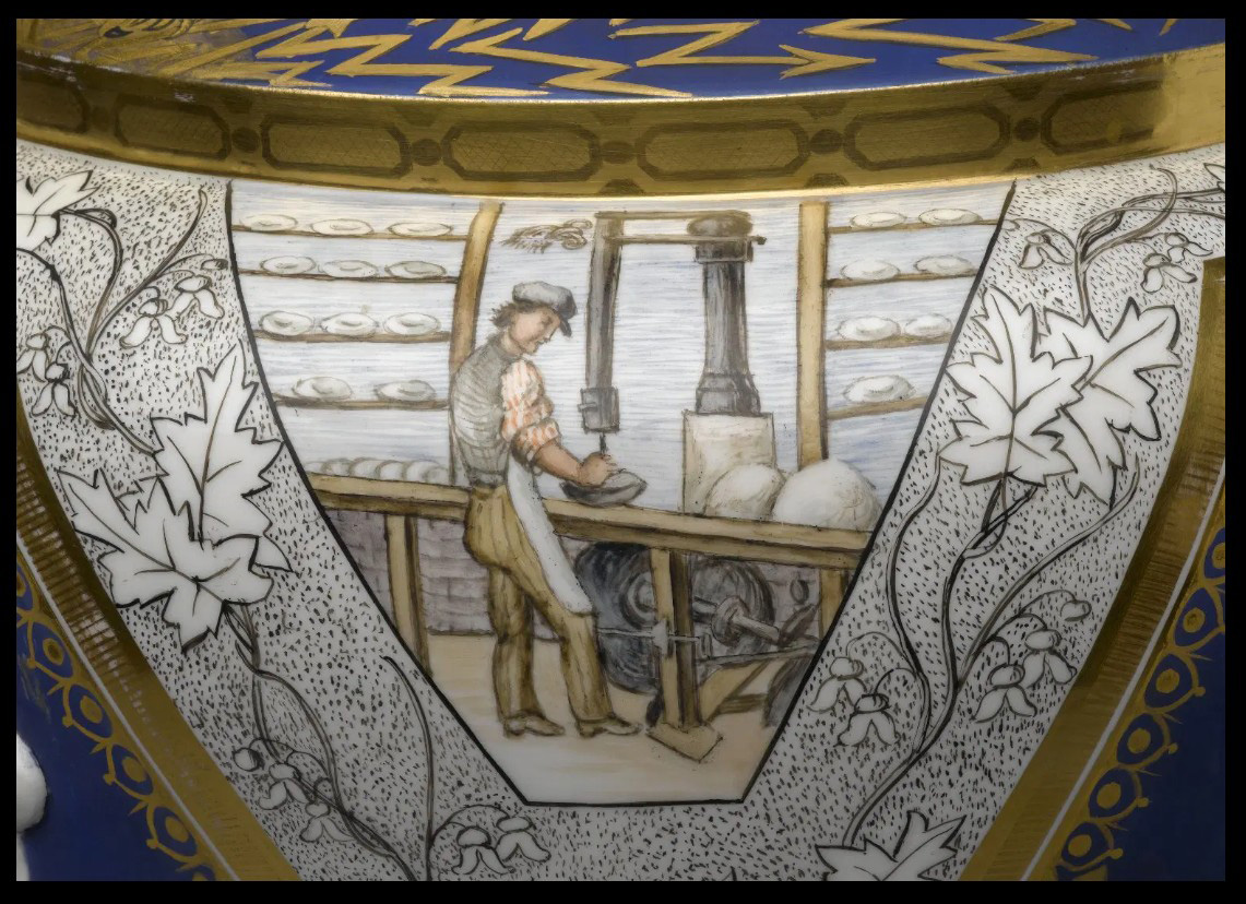 Man using lathe on clay bowl in factory