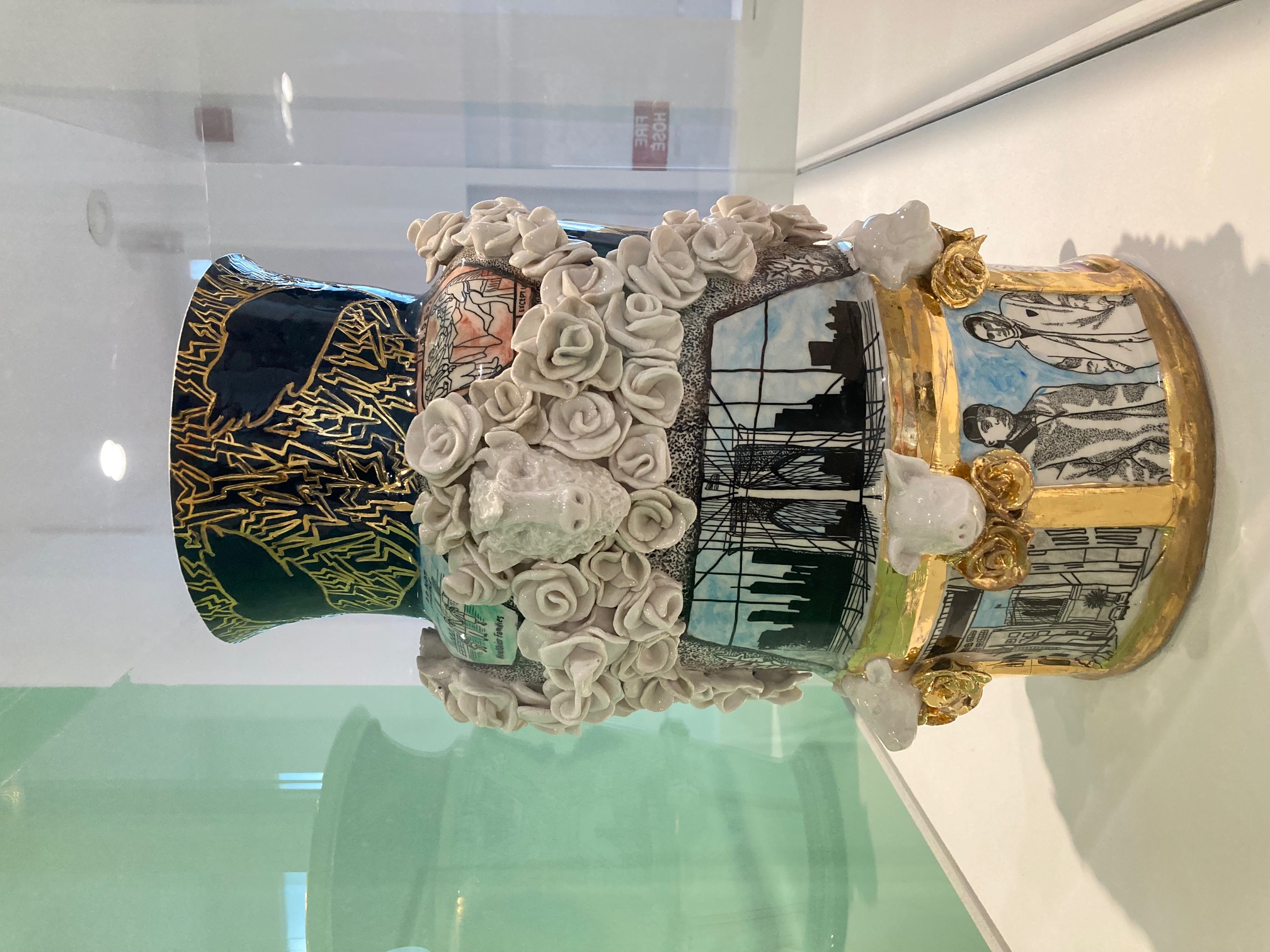 Large porcelain vase covered with flowers, gold leaf and scenes of Brooklyn