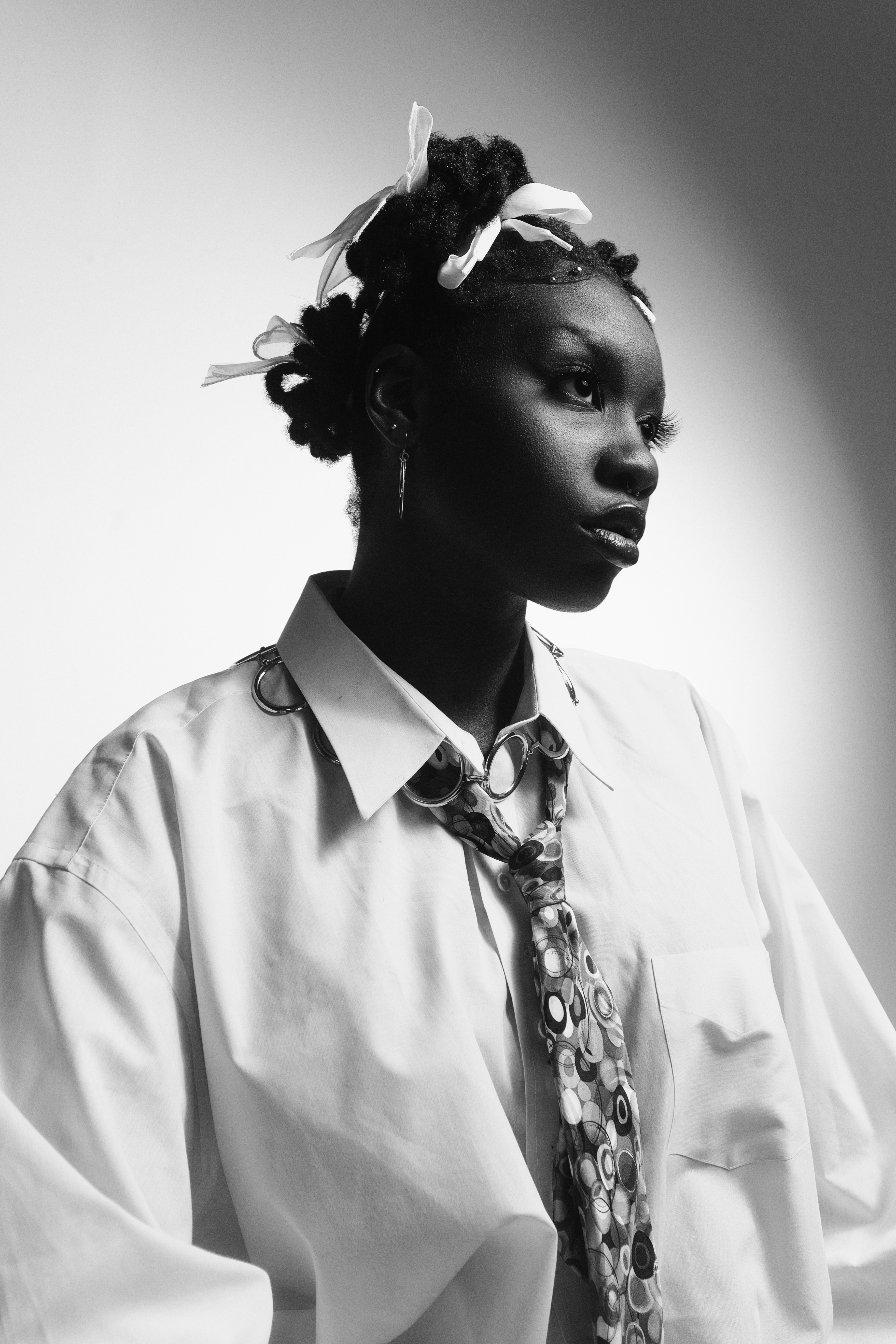 black and white photo of woman in a white shirt