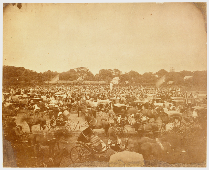Sepia photograph of the Carriage Concourse packed with horse-drawn carriages.