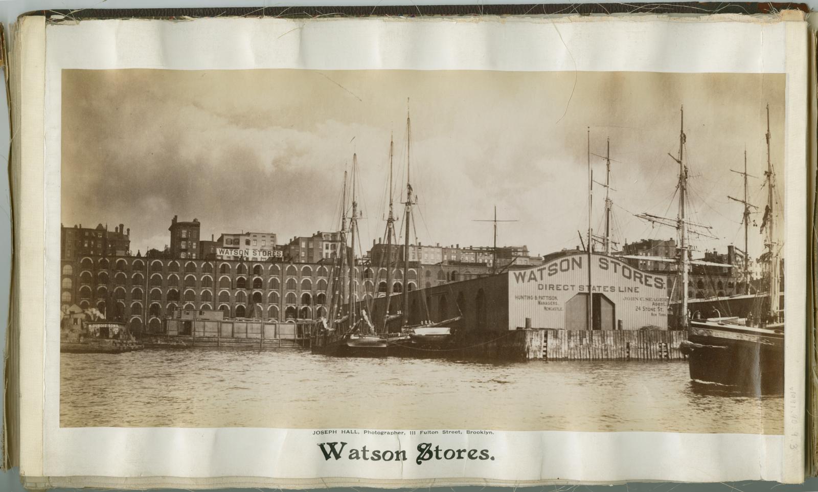 Sepia photograph of Watson Stores (storage) on the East River waterfront. 