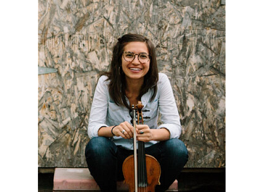 woman wearing glasses holding violin 