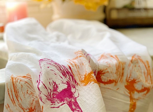 tea towel printed in bright ink with vegetables