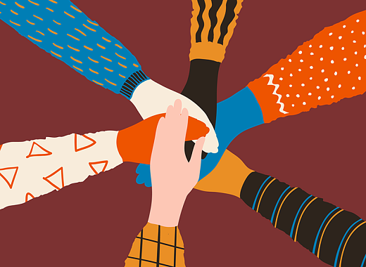 Hands stacked on top of each other, representing unity. 