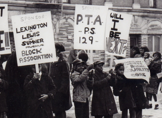 Unity Democratic Club holding protest signs